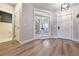 Bright foyer with wood flooring, a view to the office, and a view to the bathroom at 795 Woodmoor Acres Dr, Monument, CO 80132