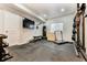 Home gym featuring rubber floor and workout equipment including weights and punching bag at 795 Woodmoor Acres Dr, Monument, CO 80132
