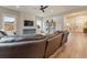 Cozy living room features a board and batten accent wall, a large television, and recessed lighting at 795 Woodmoor Acres Dr, Monument, CO 80132