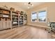 Cozy office featuring custom built-in shelving and a window with natural light at 795 Woodmoor Acres Dr, Monument, CO 80132