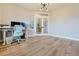 Well-lit office space with sleek desk, comfortable chair, and French door access to the foyer at 795 Woodmoor Acres Dr, Monument, CO 80132