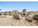 Outdoor living space with stone fireplace, comfortable seating, and a built in BBQ at 795 Woodmoor Acres Dr, Monument, CO 80132