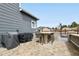 Close up shot of the outdoor kitchen featuring a built in BBQ, counter seating, and cover grill at 795 Woodmoor Acres Dr, Monument, CO 80132