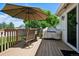 Relaxing deck with umbrella, grill, and outdoor seating perfect for entertaining at 9747 W Peakview Dr, Littleton, CO 80123