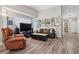 Inviting living room with large windows, vaulted ceilings, and stylish decor and furnishings at 9747 W Peakview Dr, Littleton, CO 80123