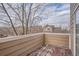 Private balcony offering views of surrounding trees and neighborhood at 6847 S Webster St # A, Littleton, CO 80128