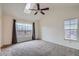 Spacious bedroom with a skylight, ceiling fan and large windows at 6847 S Webster St # A, Littleton, CO 80128