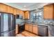 Well-lit kitchen with stainless steel appliances and a stylish backsplash at 6847 S Webster St # A, Littleton, CO 80128