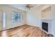 Inviting living room with a fireplace, wood floors and plenty of natural light at 6847 S Webster St # A, Littleton, CO 80128