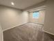 This basement bedroom has neutral walls and carpeting with a single window at 9482 Kendrick Way, Arvada, CO 80007