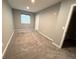 Bedroom with large window for ample natural light, and plush carpeting at 9482 Kendrick Way, Arvada, CO 80007