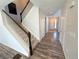 Inviting entryway with hardwood floors and a staircase leading to the upper level at 9482 Kendrick Way, Arvada, CO 80007