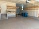 Spacious garage with epoxy floor and custom shelving for organized storage at 9482 Kendrick Way, Arvada, CO 80007