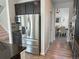 Spacious kitchen featuring stainless steel refrigerator, microwave and granite countertops at 9482 Kendrick Way, Arvada, CO 80007