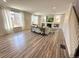 Bright living room with fireplace, built-ins and ample natural light at 9482 Kendrick Way, Arvada, CO 80007