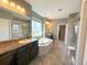 Luxurious main bathroom featuring a soaking tub, dual vanities, and a glass-enclosed shower at 9482 Kendrick Way, Arvada, CO 80007