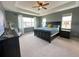 Spacious main bedroom with tray ceiling, soft carpet and large windows at 9482 Kendrick Way, Arvada, CO 80007