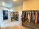 Large walk-in closet with custom shelving and ample storage space for clothing and accessories at 9482 Kendrick Way, Arvada, CO 80007