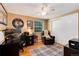 Bedroom featuring neutral walls, desk, and closet with sliding doors at 6624 S Sycamore St, Littleton, CO 80120