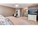 Spacious main bedroom with walk-in closet, ensuite bathroom, and comfortable bed at 6624 S Sycamore St, Littleton, CO 80120