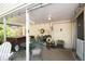 Covered patio area with comfortable seating, including hot tub for relaxation at 6624 S Sycamore St, Littleton, CO 80120