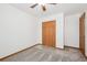 Bedroom with large closet, bright window, and neutral carpeting at 1843 S Pierson Ct, Lakewood, CO 80232