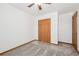 Bedroom with carpet floors, ceiling fan, closet with wood doors at 1843 S Pierson Ct, Lakewood, CO 80232