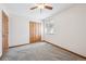 Bedroom with large closet, bright window, and neutral carpeting at 1843 S Pierson Ct, Lakewood, CO 80232