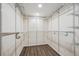 Spacious closet with custom shelving and wood-look flooring offering ample storage at 1843 S Pierson Ct, Lakewood, CO 80232