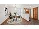 Dining room area with a round table and chairs near the front door entrance at 1843 S Pierson Ct, Lakewood, CO 80232