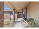 Inviting home entrance with a decorative door, a brick pillar and well maintained landscaping at 1843 S Pierson Ct, Lakewood, CO 80232