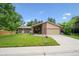 Charming single-Gathering home featuring a brick facade, manicured lawn, and attached two-car garage at 1843 S Pierson Ct, Lakewood, CO 80232