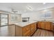 Kitchen island with countertop and fireplace, great natural light and wood floors at 1843 S Pierson Ct, Lakewood, CO 80232