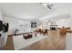 Bright living room features hardwood floors, a fireplace, and a large window at 1843 S Pierson Ct, Lakewood, CO 80232