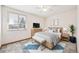 Bright main bedroom with carpet flooring, a ceiling fan and an exterior view at 1843 S Pierson Ct, Lakewood, CO 80232