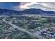 Aerial view of the neighborhood showcasing mountain views and well-maintained streets at 3242 Waterfront Dr, Monument, CO 80132