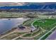 Aerial view of the community, showcasing the lake, trails, playground and green spaces at 3242 Waterfront Dr, Monument, CO 80132