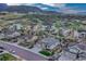Idyllic neighborhood aerial view with well-manicured lawns and mountain views at 3242 Waterfront Dr, Monument, CO 80132