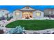 Well-maintained backyard features a lush lawn and patio, great for outdoor relaxation at 3242 Waterfront Dr, Monument, CO 80132