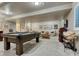 Basement game room featuring a pool table, seating, and a media center at 3242 Waterfront Dr, Monument, CO 80132