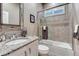 Bathroom with granite vanity, modern fixtures, and tiled shower/tub combo at 3242 Waterfront Dr, Monument, CO 80132