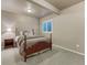 Bedroom with neutral colors, window to the outside, and small side table at 3242 Waterfront Dr, Monument, CO 80132