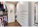Walk-in closet with white storage cabinets and shelving at 3242 Waterfront Dr, Monument, CO 80132