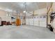 Spacious three-car garage with ample storage and epoxy flooring at 3242 Waterfront Dr, Monument, CO 80132
