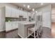 Bright kitchen features granite countertops, stainless steel appliances, and pendant lighting at 3242 Waterfront Dr, Monument, CO 80132