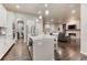 Open kitchen and living room, boasting a large island, granite countertops, and stainless appliances at 3242 Waterfront Dr, Monument, CO 80132
