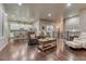 Spacious open concept living room that connects to the kitchen, and has hardwood flooring at 3242 Waterfront Dr, Monument, CO 80132