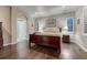 Comfortable main bedroom with hardwood floors, recessed lighting, and an ensuite bathroom at 3242 Waterfront Dr, Monument, CO 80132