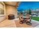 Relaxing patio with outdoor seating and a grill, great for entertaining guests at 3242 Waterfront Dr, Monument, CO 80132