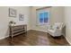 Bright sitting room features hardwood floors, window seat, and natural light at 3242 Waterfront Dr, Monument, CO 80132